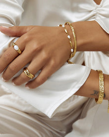 Anel Torcido com Pérola - Ouro 18K | SILLENE