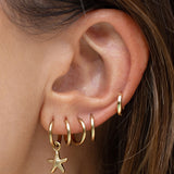 Brinco Estrela-do-Mar - Ouro 18K | SILLENE - uso