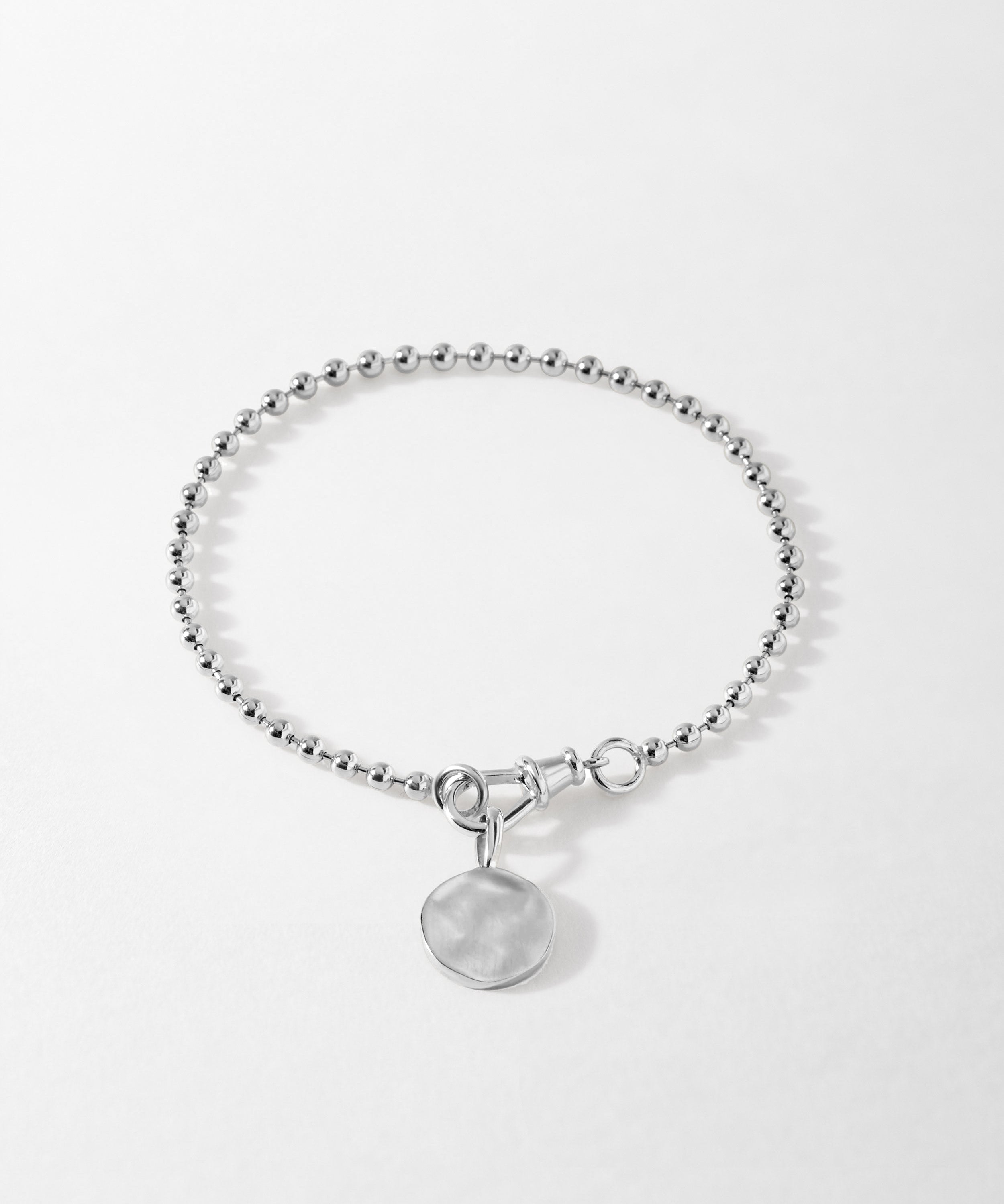 Pulseira Moeda Globo - Prata | SILLENE