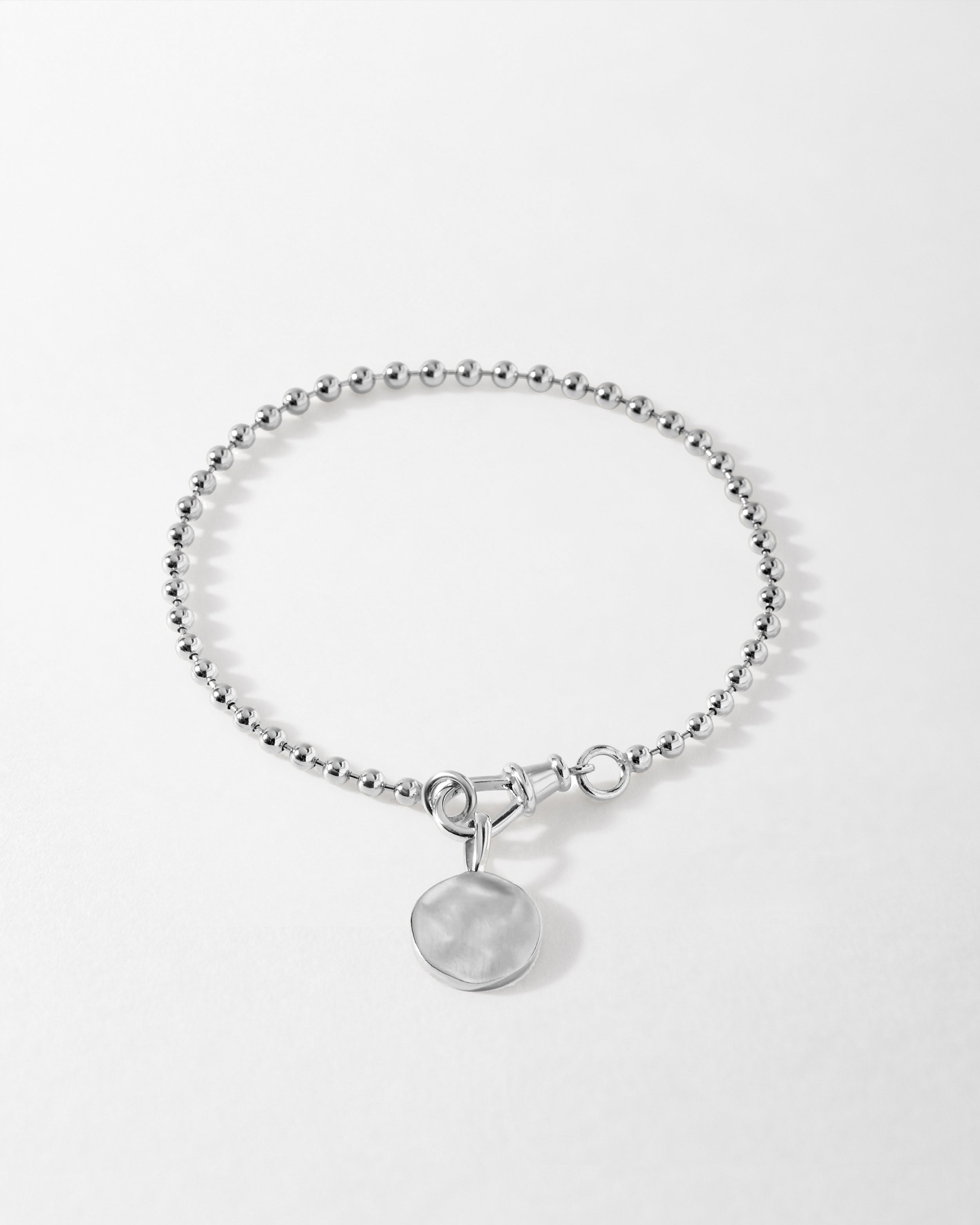 Pulseira Moeda Globo - Prata | SILLENE